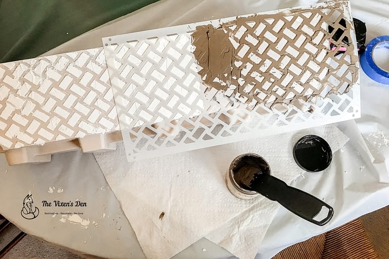layering sections of Dixie Belle Mud raised stencil on plastic planters