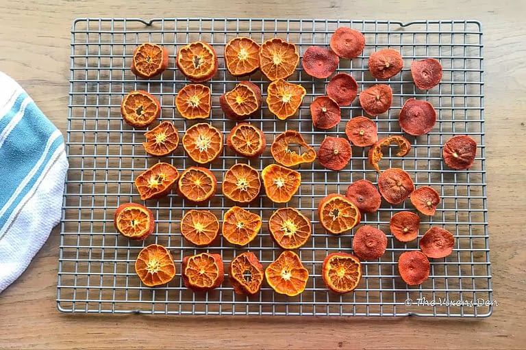 a wire rack of dried orange slices