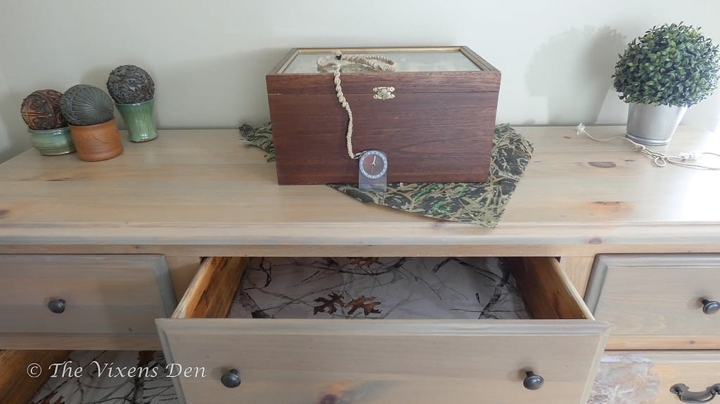raw wood stained dresser with camo drawer lining