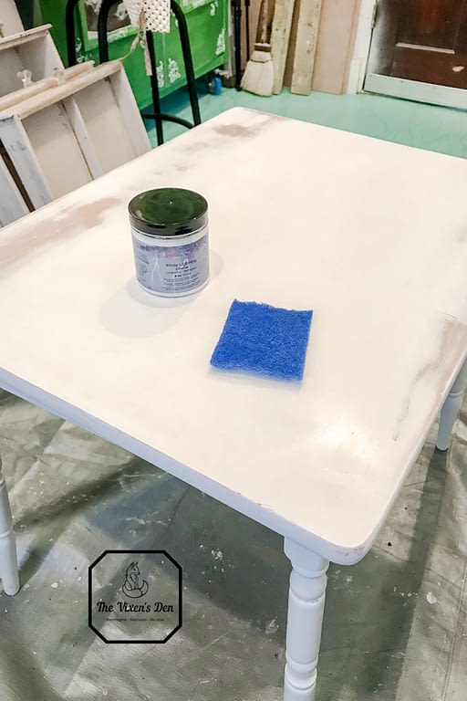 children's table with white lightning cleaner and a scratch resistant scrubber
