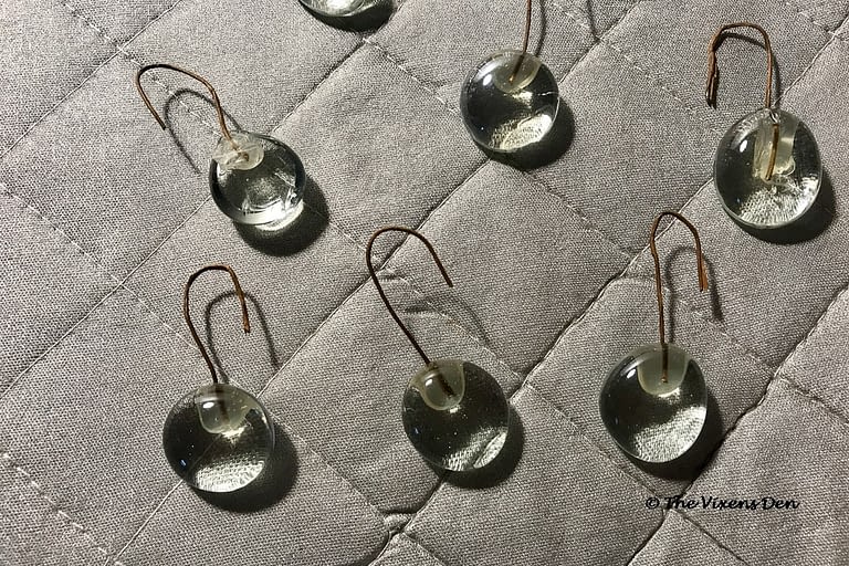 clear flat glass marbles with floral wire hooks hot glued onto them
