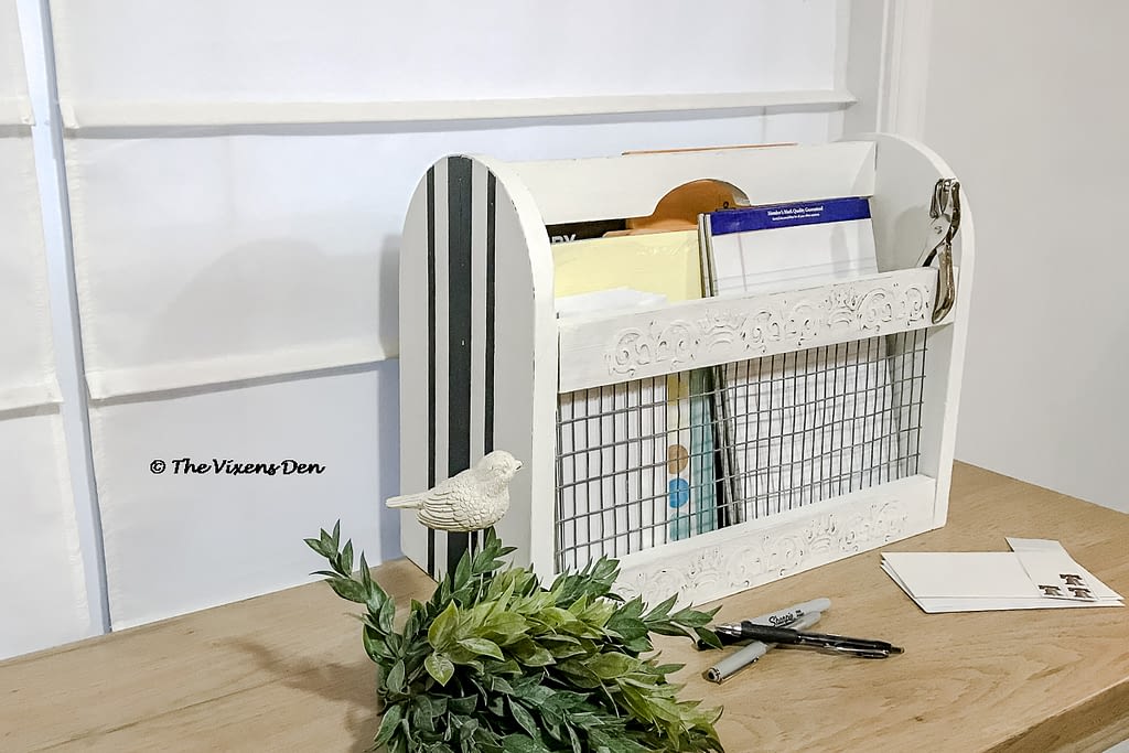 repurposed magazine rack staged as an office supply caddy