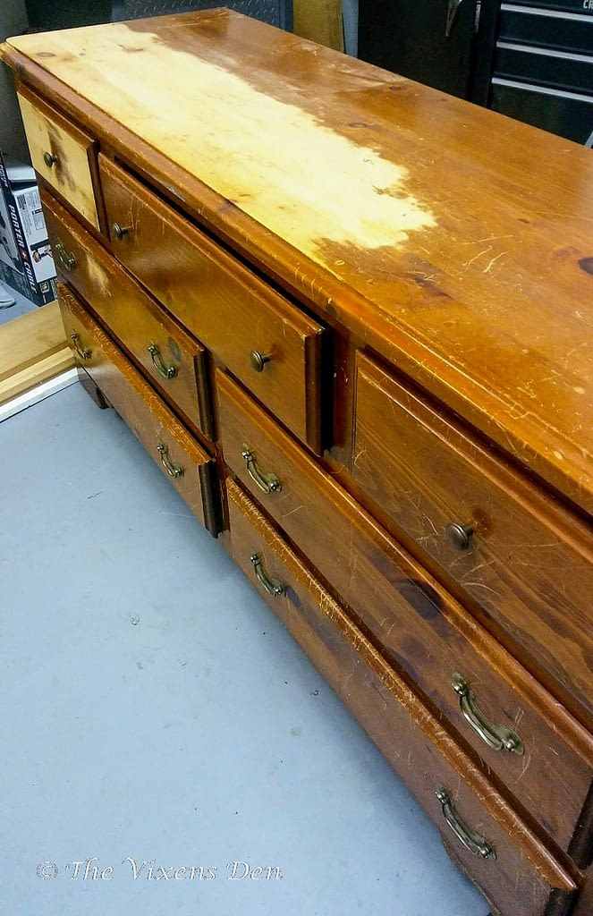 partially sanded solid pine dresser with orange finish