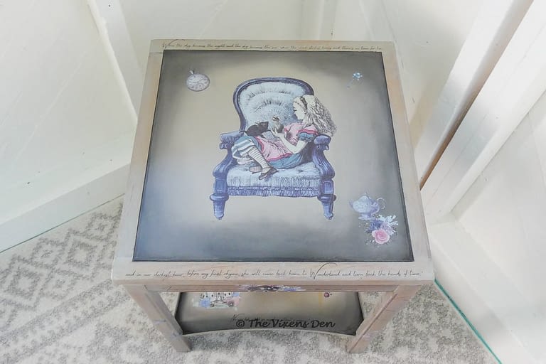 view of painted side table with Alice in Wonderland transfers and quotes from the story