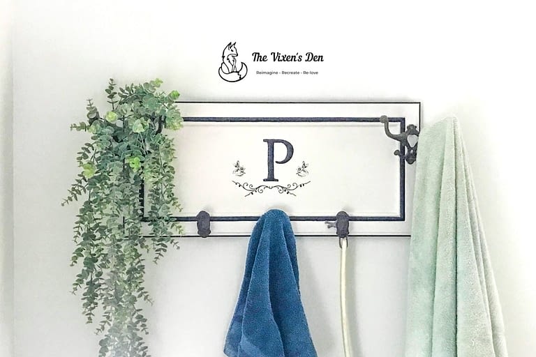 upcycled cabinet door to a towel rack