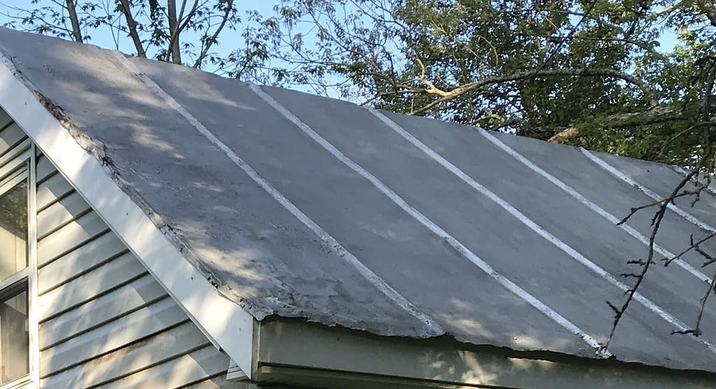 damaged tin roof corner